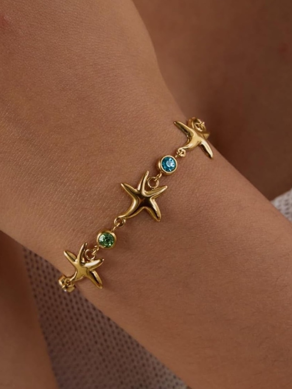 Anthropologie Gold Starfish Bracelet with Blue and Green Stones